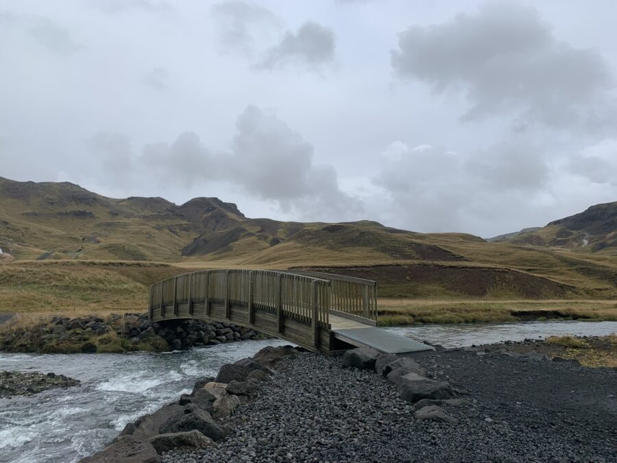 A bridge over a river that splits. 