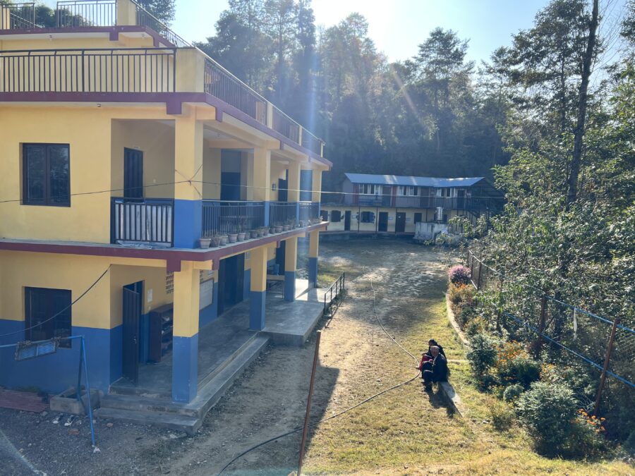 The school yard and some school buildings, at the local school in Patlekhet, Nepal. 