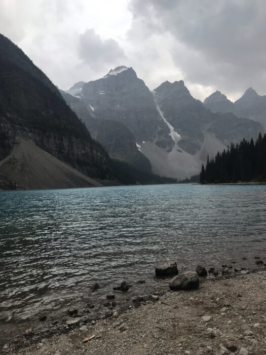 A beautiful blue lake with mountains in the background in BC. Canada.