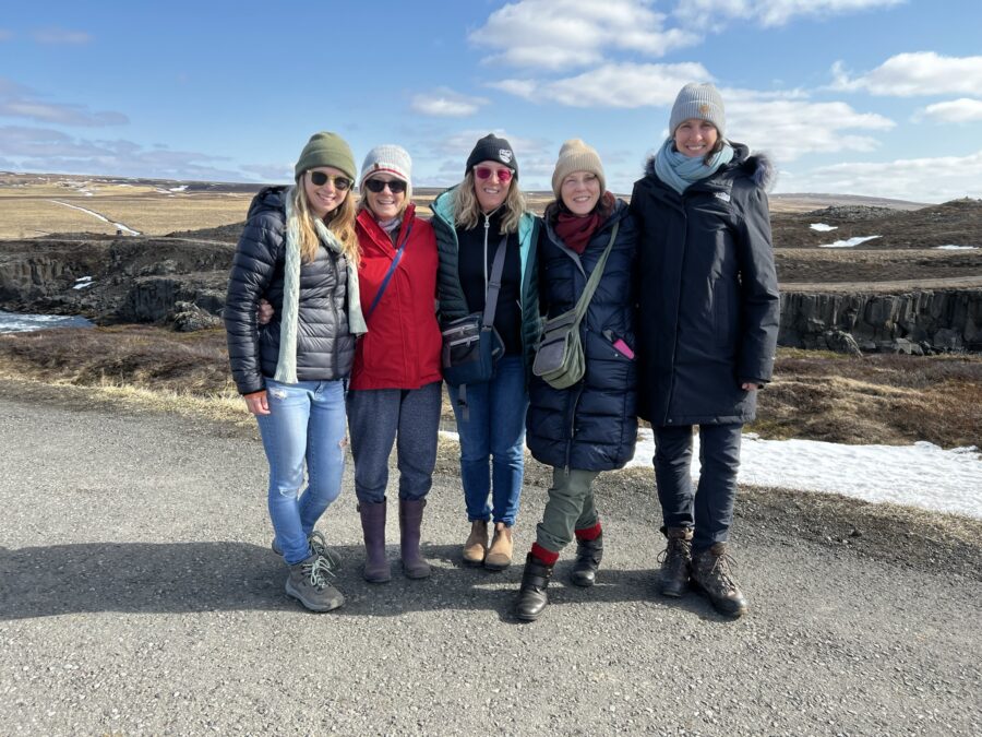 5 women wearing layers on an Iceland trip