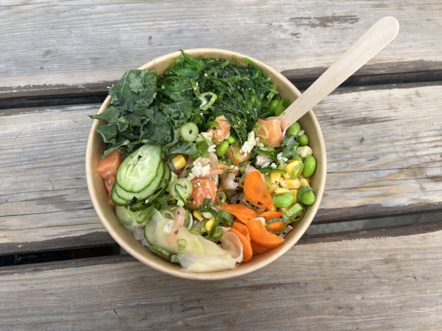 A poke bowl in a takeout container