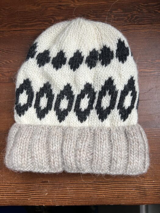 A white and grey wool hat 