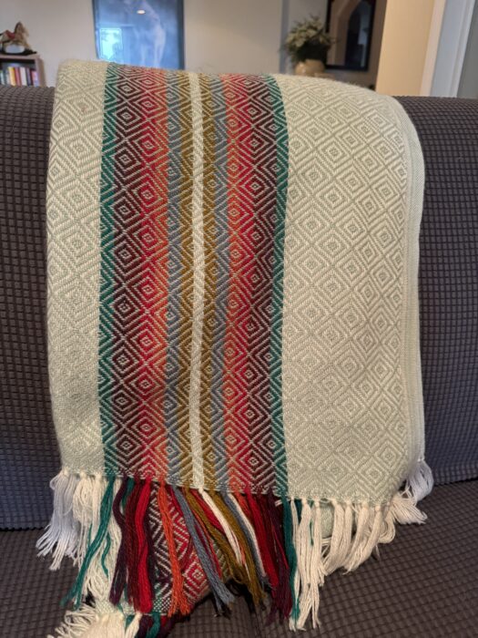 A blue patterned alpaca wool blanket from Peru