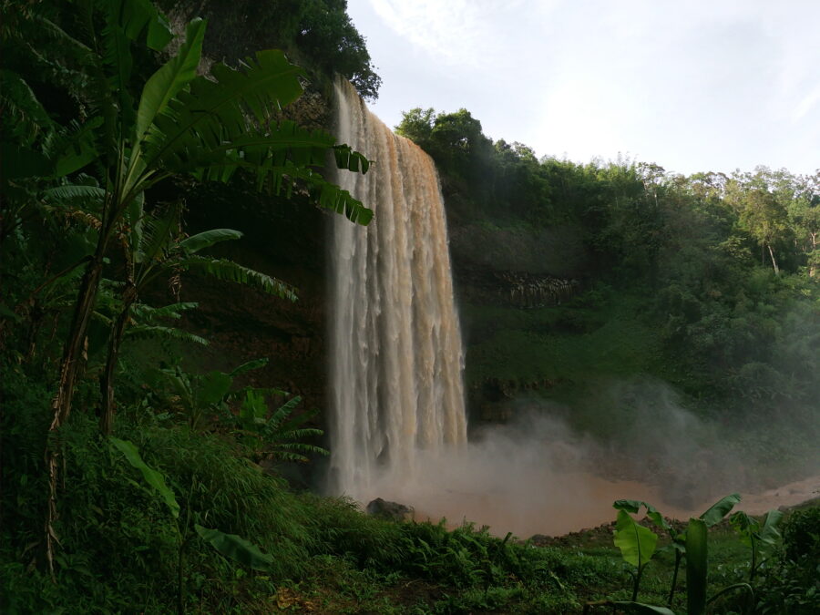 A beautiful waterfall as a setting for a travel romance