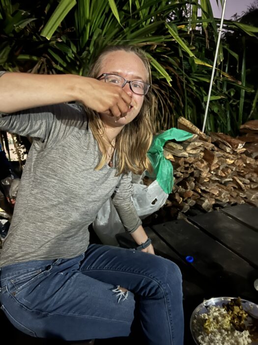 A traveller eating food with her hands in Nepal. 