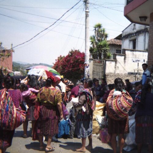 A travel photo of a group of local women on a Guatemala street