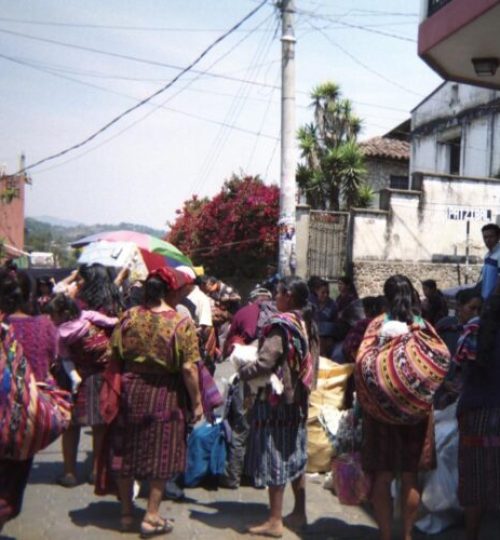 A travel photo of a group of local women on a Guatemala street